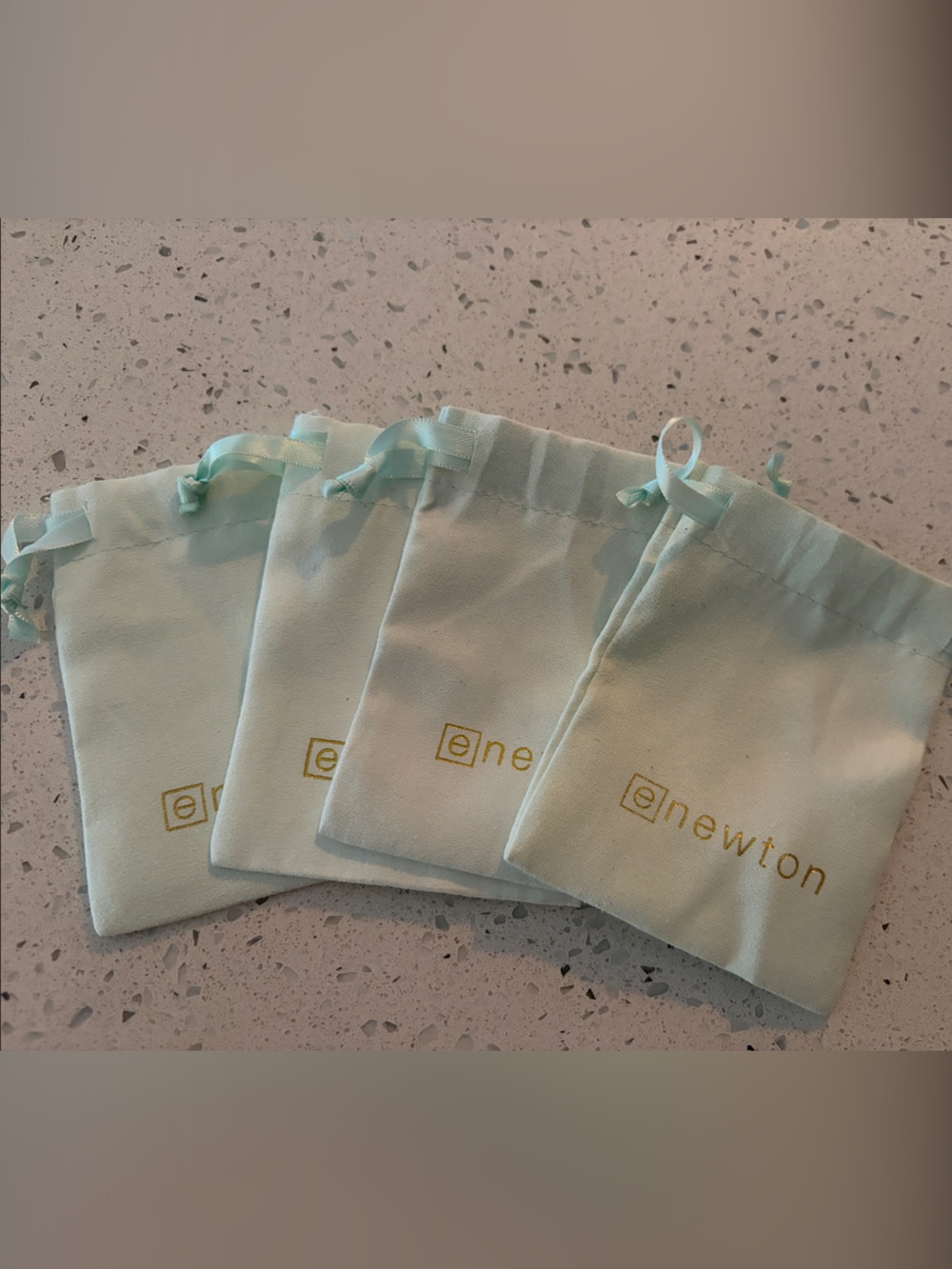 ene w. ton Drawstring Pouches in Light Aqua